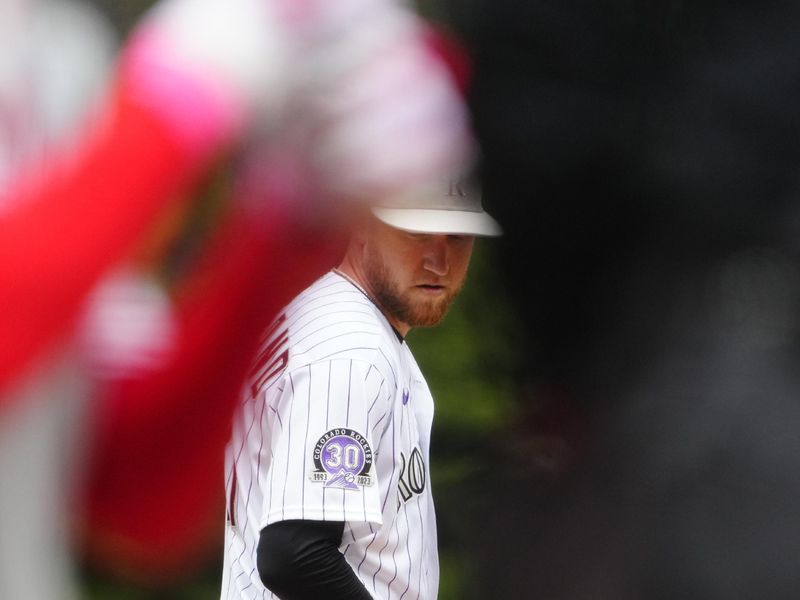 May 14, 2023; Denver, Colorado, USA; Colorado Rockies starting pitcher Kyle Freeland (21) on the mound in the first inning against the Philadelphia Phillies at Coors Field. Mandatory Credit: Ron Chenoy-USA TODAY Sports