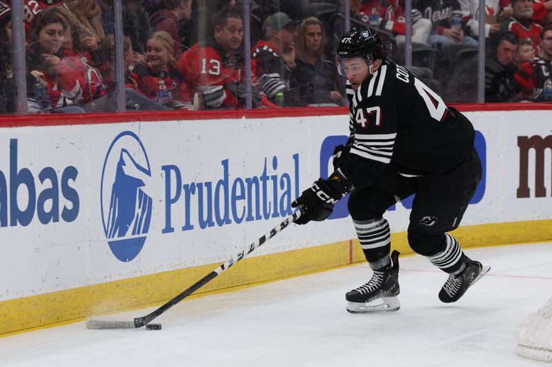 Dec 21, 2025; Newark, New Jersey, USA;  New Jersey Devils left wing Paul Cotter (47) shakes with the puck against the Buffalo Sabres during the second period at Prudential Center. Mandatory Credit: Thomas Salus-Imagn Images