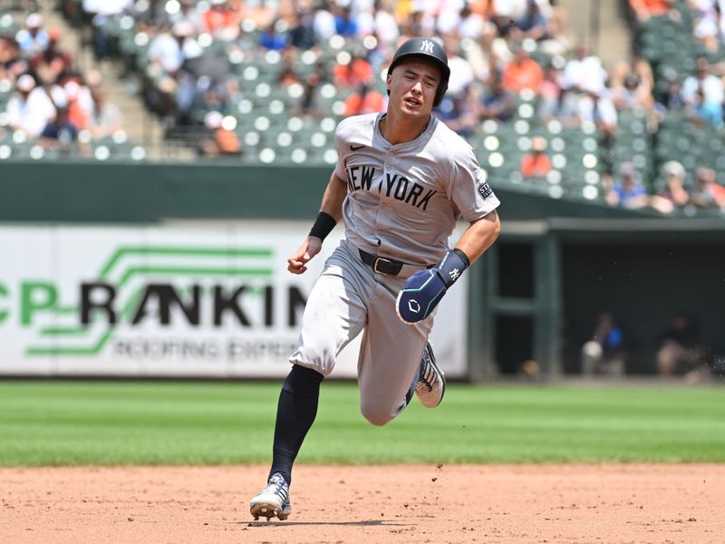 Jul 14, 2024; Baltimore, Maryland, USA;  New York Yankees shortstop Anthony Volpe (11) rounds the bases during the sixth inning against the Baltimore Orioles at Oriole Park at Camden Yards. Mandatory Credit: James A. Pittman-USA TODAY Sports