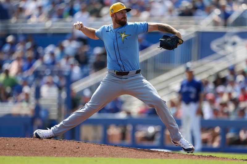 Feb 28, 2024; Dunedin, Florida, USA;  Tampa Bay Rays relief pitcher Chris Devenski (48) throws a pitch against the Toronto Blue Jays in the fourth inning at TD Ballpark. Mandatory Credit: Nathan Ray Seebeck-USA TODAY Sports