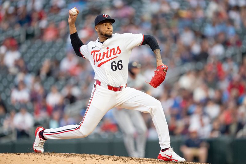 Jul 2, 2024; Minneapolis, Minnesota, USA; Minnesota Twins pitcher Jorge Alcala (66) pitches to the Detroit Tigers in the seventh inning at Target Field. Mandatory Credit: Matt Blewett-USA TODAY Sports