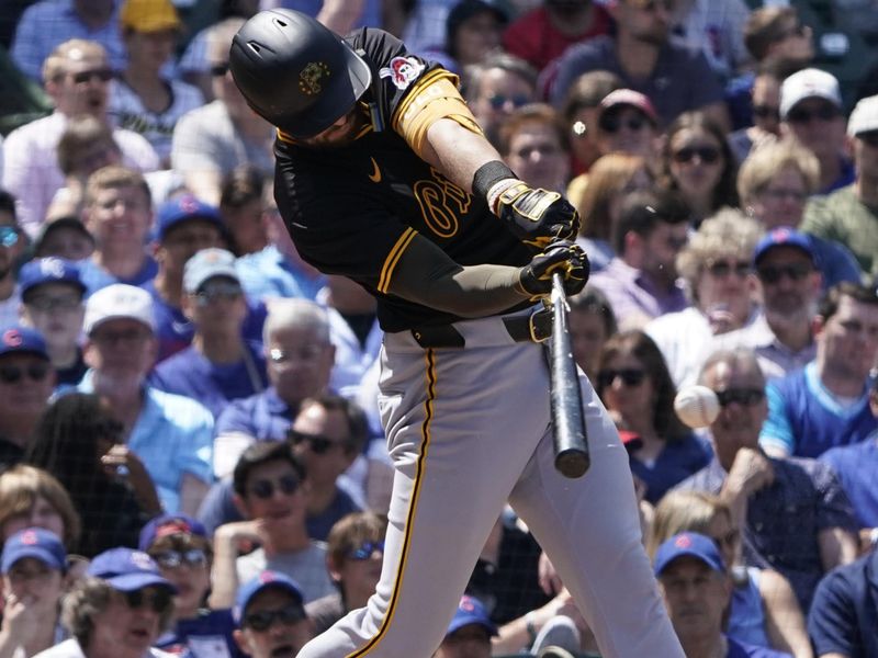 May 17, 2024; Chicago, Illinois, USA; Pittsburgh Pirates third baseman Jared Triolo (19) hits a two-run single against the Chicago Cubs during the fourth inning at Wrigley Field. Mandatory Credit: David Banks-USA TODAY Sports