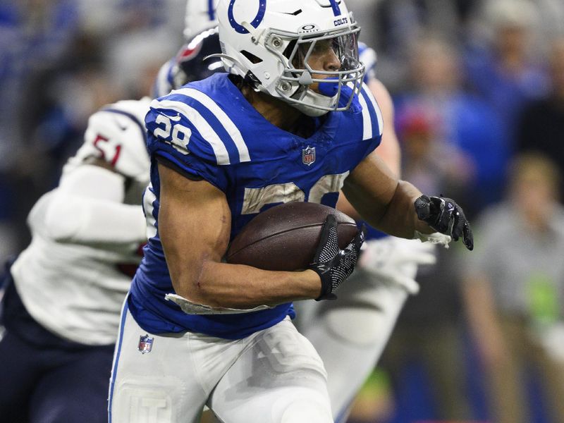 Indianapolis Colts running back Jonathan Taylor (28) runs to the outside during an NFL football game against the Houston Texans, Saturday, Jan. 6, 2024, in Indianapolis. (AP Photo/Zach Bolinger)