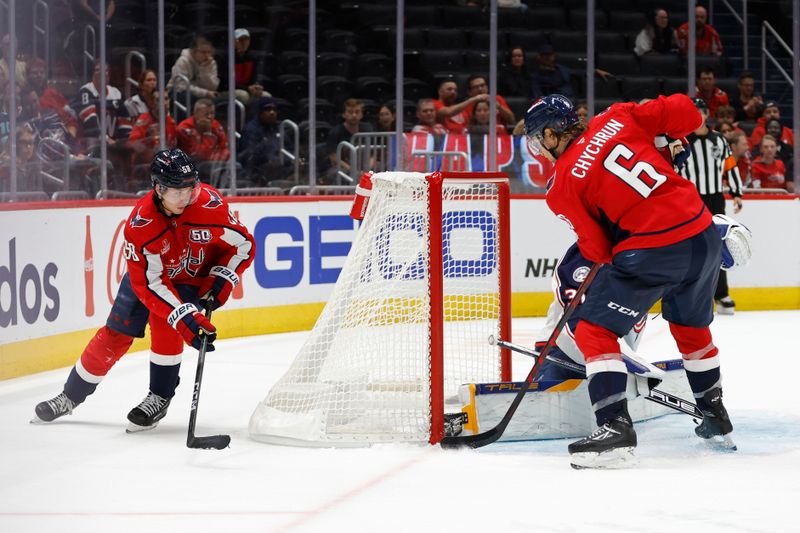 Sep 27, 2024; Washington, District of Columbia, USA; Washington Capitals defenseman Jakob Chychrun (6) scores a goal on Columbus Blue Jackets goaltender Pavel Cajan (30) in the third period at Capital One Arena. Mandatory Credit: Geoff Burke-Imagn Images