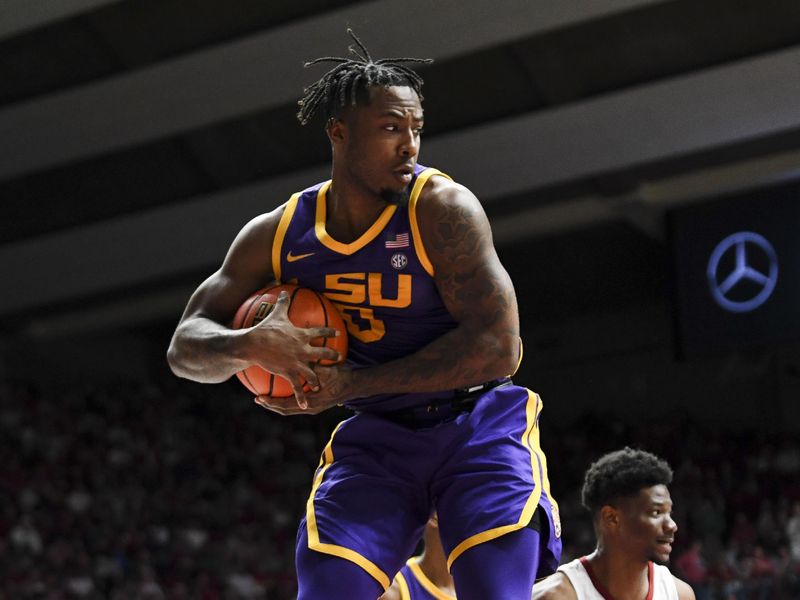 Jan 27, 2024; Tuscaloosa, Alabama, USA; LSU guard Trae Hannibal (0) grabs a rebound against Alabama at Coleman Coliseum. Mandatory Credit: Gary Cosby Jr.-USA TODAY Sports