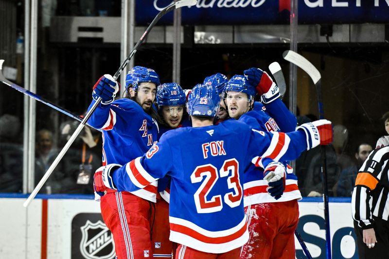 Nov 30, 2024; New York, New York, USA; New York Rangers left wing Artemi Panarin (10) celebrates with teammates after scoring a goal against the Montreal Canadiens during the first period at Madison Square Garden. Mandatory Credit: John Jones-Imagn Images