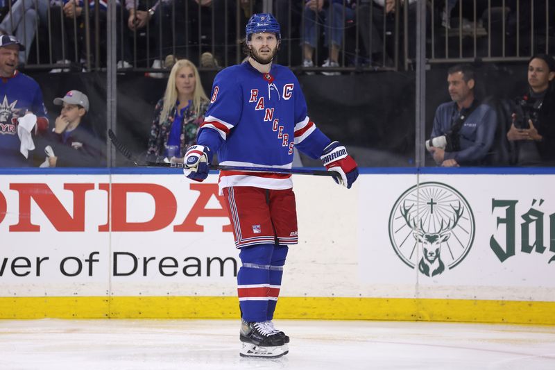 May 13, 2024; New York, New York, USA; New York Rangers defenseman Jacob Trouba (8) reacts during the third period of game five of the second round of the 2024 Stanley Cup Playoffs against the Carolina Hurricanes at Madison Square Garden. Mandatory Credit: Brad Penner-USA TODAY Sports