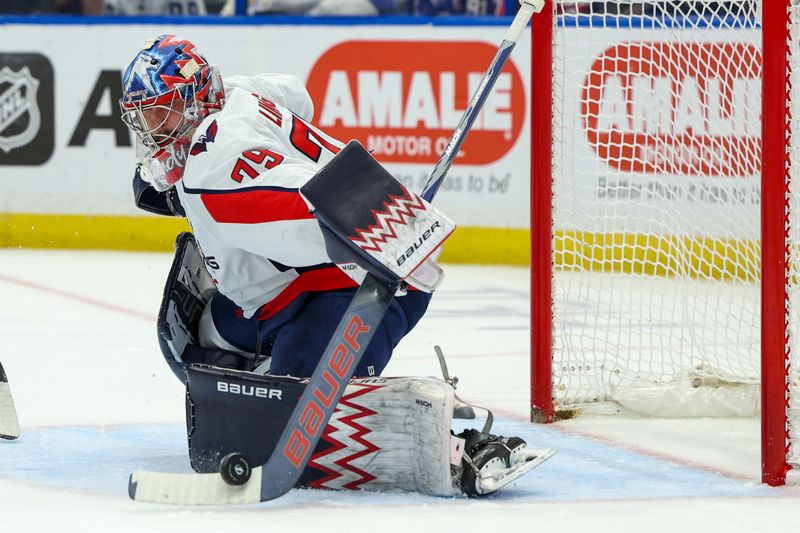 Feb 22, 2024; Tampa, Florida, USA;  Washington Capitals goaltender Charlie Lindgren (79) makes a save against the Tampa Bay Lightning in the first period at Amalie Arena. Mandatory Credit: Nathan Ray Seebeck-USA TODAY Sports