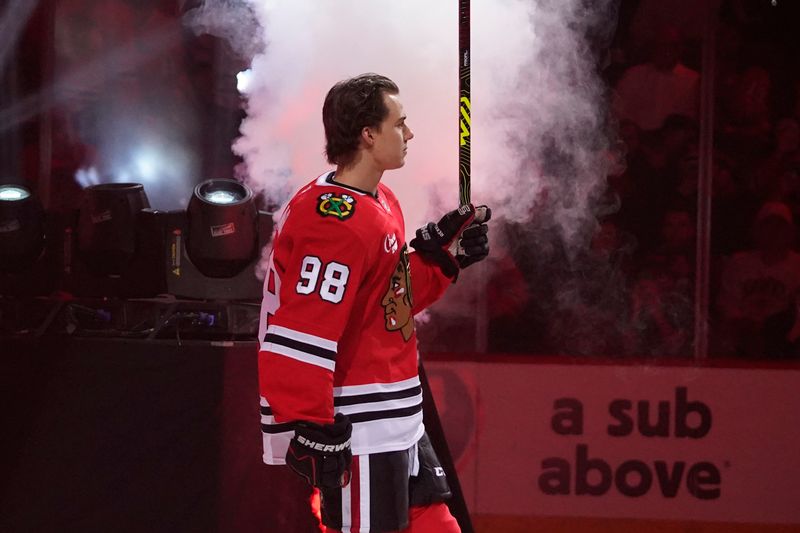 Oct 17, 2024; Chicago, Illinois, USA; Chicago Blackhawks center Connor Bedard (98) is introduced on opening night against the San Jose Sharks at United Center. Mandatory Credit: David Banks-Imagn Images