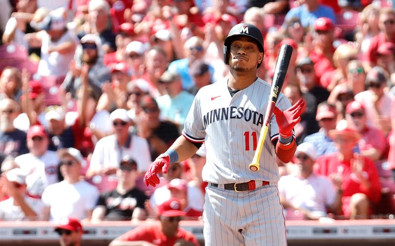 Sep 20, 2023; Cincinnati, Ohio, USA; Minnesota Twins second baseman Jorge Polanco (11) reacts after striking out against the Cincinnati Reds during the third inning at Great American Ball Park. Mandatory Credit: David Kohl-USA TODAY Sports