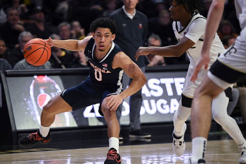 Jan 21, 2023; Winston-Salem, North Carolina, USA;  Virginia Cavaliers guard Kihei Clark (0) makes a cut around Wake Forest Demon Deacons guard Tyree Appleby (1) during the second half at Lawrence Joel Veterans Memorial Coliseum. Mandatory Credit: William Howard-USA TODAY Sports