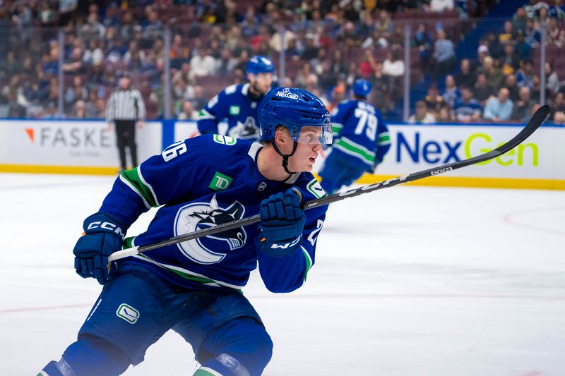 Sep 24, 2024; Vancouver, British Columbia, CAN; Vancouver Canucks defenseman Elias Pettersson (26) skates against the Seattle Kraken during the second period at Rogers Arena. Mandatory Credit: Bob Frid-Imagn Images