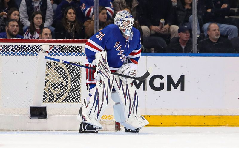 Nov 25, 2024; New York, New York, USA; New York Rangers goalie Igor Shesterkin (31) was forced to play with a teammate’s stick after losing his goalie stick during the second period against the St. Louis Blues at Madison Square Garden. Mandatory Credit: Danny Wild-Imagn Images