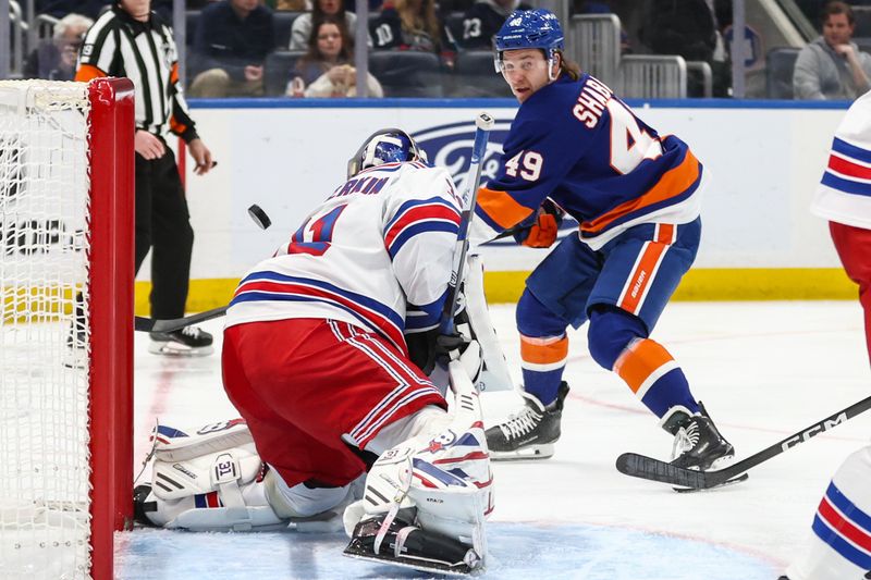 Dec 27, 2025; Elmont, New York, USA;  New York Rangers goaltender Igor Shesterkin (31) makes a save on a shot on goal attempt from New York Islanders right wing Max Shabanov (49) in the second period at UBS Arena. Mandatory Credit: Wendell Cruz-Imagn Images