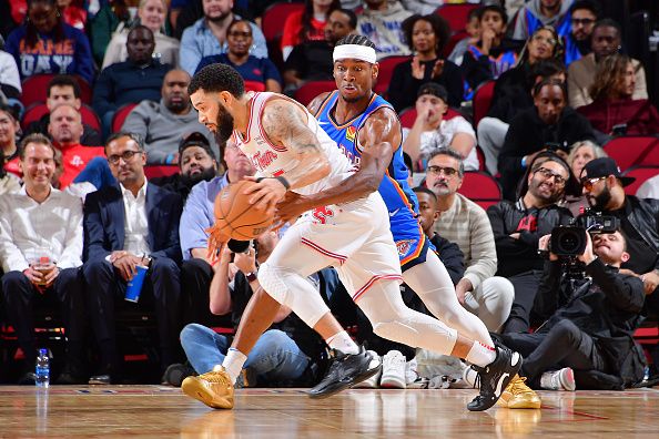 HOUSTON, TX - DECEMBER 6:   Shai Gilgeous-Alexander #2 of the Oklahoma City Thunder plays defense against Fred VanVleet #5 of the Houston Rockets during the game on December 6, 2023 at the Toyota Center in Houston, Texas. NOTE TO USER: User expressly acknowledges and agrees that, by downloading and or using this photograph, User is consenting to the terms and conditions of the Getty Images License Agreement. Mandatory Copyright Notice: Copyright 2023 NBAE (Photo by Michael Gonzales/NBAE via Getty Images)