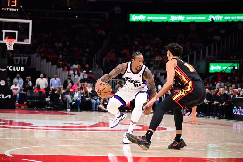 ATLANTA, GA - NOVEMBER 1: DeMar DeRozan #10 of the Sacramento Kings handles the ball during the game against the Atlanta Hawks on November 1, 2024 at State Farm Arena in Atlanta, Georgia.  NOTE TO USER: User expressly acknowledges and agrees that, by downloading and/or using this Photograph, user is consenting to the terms and conditions of the Getty Images License Agreement. Mandatory Copyright Notice: Copyright 2024 NBAE (Photo by Adam Hagy/NBAE via Getty Images)