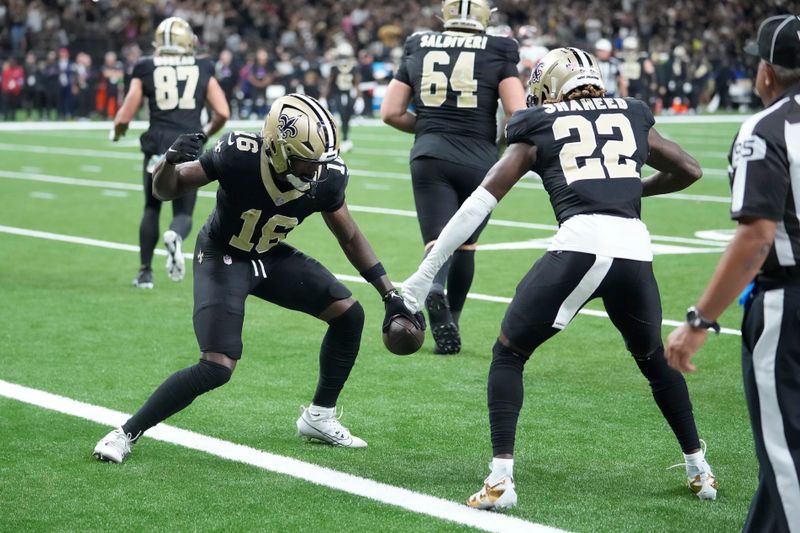 New Orleans Saints wide receiver Bub Means, left, celebrates with wide receiver Rashid Shaheed (22) after scoring against the Tampa Bay Buccaneers during the first half of an NFL football game in New Orleans, Sunday, Oct. 13, 2024. (AP Photo/Michael Conroy)