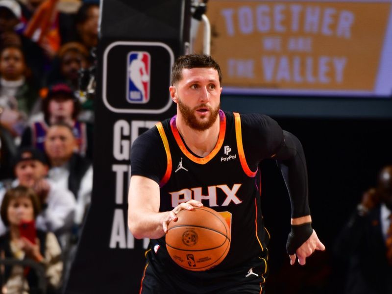 PHOENIX, AZ - FEBRUARY 6:  Jusuf Nurkic #20 of the Phoenix Suns handles the ball during the game  on February 6, 2024 at Footprint Center in Phoenix, Arizona. NOTE TO USER: User expressly acknowledges and agrees that, by downloading and or using this photograph, user is consenting to the terms and conditions of the Getty Images License Agreement. Mandatory Copyright Notice: Copyright 2024 NBAE (Photo by Barry Gossage/NBAE via Getty Images)