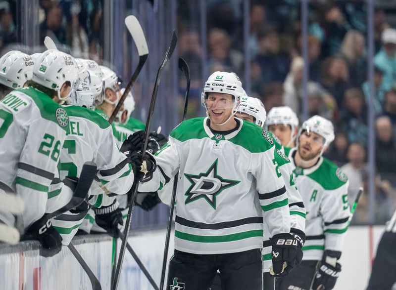 Nov 26, 2025; Seattle, Washington, USA; Dallas Stars defenseman Esa Lindell (23) celebrates with teammates on the bench after scoring a goal during the second period at Climate Pledge Arena. Mandatory Credit: Stephen Brashear-Imagn Images