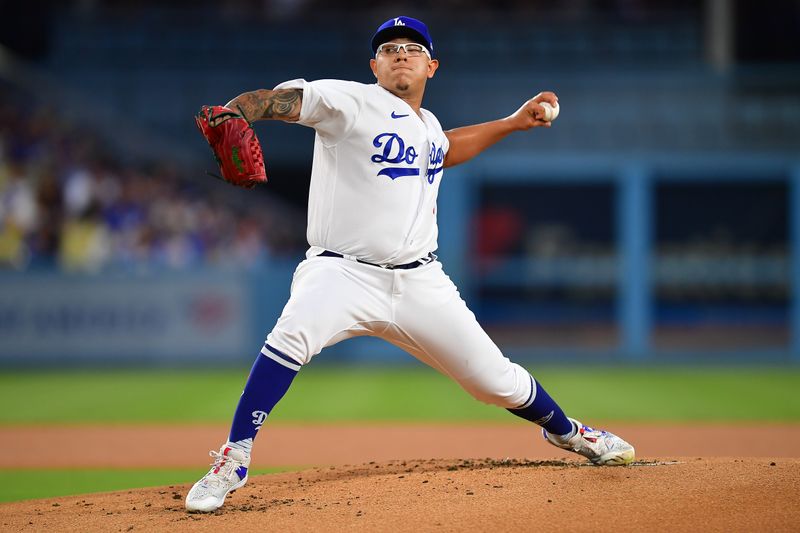 September 1, 2023; Los Angeles, California, USA; Los Angeles Dodgers starting pitcher Julio Urias (7) throws against the Atlanta Braves during the first inning at Dodger Stadium. Mandatory Credit: Gary A. Vasquez-USA TODAY Sports