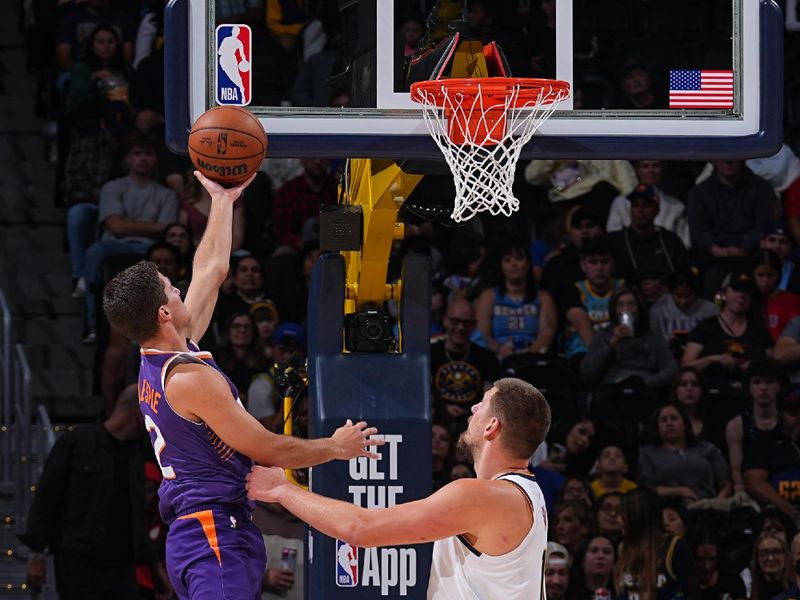 DENVER, CO - OCTOBER 13: Collin Gillespie #12 of the Phoenix Suns drives to the basket during the game against the Denver Nuggets on October 13, 2024 at Ball Arena in Denver, Colorado. NOTE TO USER: User expressly acknowledges and agrees that, by downloading and/or using this Photograph, user is consenting to the terms and conditions of the Getty Images License Agreement. Mandatory Copyright Notice: Copyright 2024 NBAE (Photo by Bart Young/NBAE via Getty Images)