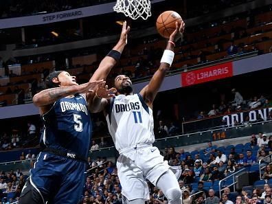 ORLANDO, FL - NOVEMBER 6: Kyrie Irving #11 of the Dallas Mavericks drives to the basket during the game against the Orlando Magic on November 6, 2023 at Amway Center in Orlando, Florida. NOTE TO USER: User expressly acknowledges and agrees that, by downloading and or using this photograph, User is consenting to the terms and conditions of the Getty Images License Agreement. Mandatory Copyright Notice: Copyright 2023 NBAE (Photo by Gary Bassing/NBAE via Getty Images)