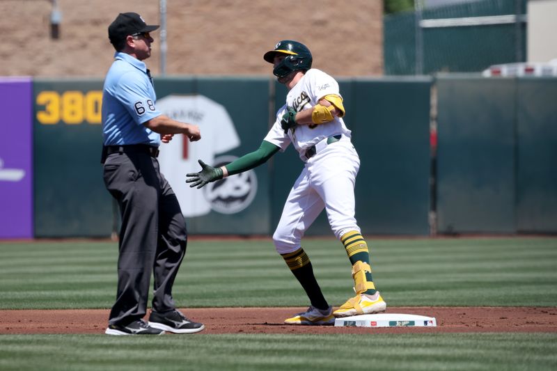 May 10, 2025; West Sacramento, California, USA; Athletics short stop Jacob Wilson (5) reacts after hitting a double against the New York Yankees during the first inning at Sutter Health Park. Mandatory Credit: Dennis Lee-Imagn Images