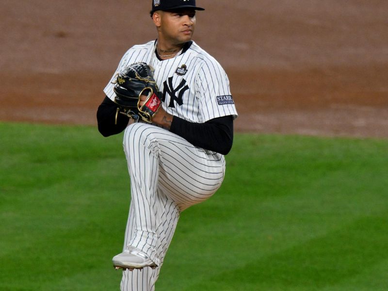 Oct 29, 2024; New York, New York, USA; New York Yankees pitcher Luis Gil (81) throws during the first inning in game four of the 2024 MLB World Series against the Los Angeles Dodgers at Yankee Stadium. Mandatory Credit: John Jones-Imagn Images