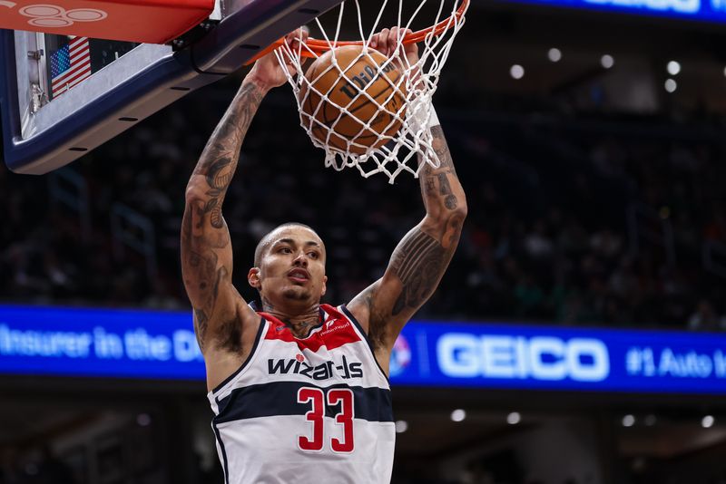 WASHINGTON, DC - OCTOBER 24: Kyle Kuzma #33 of the Washington Wizards dunks the ball against the Boston Celtics during the first half at Capital One Arena on October 24, 2024 in Washington, DC. NOTE TO USER: User expressly acknowledges and agrees that, by downloading and or using this photograph, User is consenting to the terms and conditions of the Getty Images License Agreement. (Photo by Scott Taetsch/Getty Images)