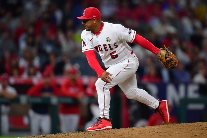 Sep 15, 2023; Anaheim, California, USA; Los Angeles Angels third baseman Eduardo Escobar (5) throws in relief against the Detroit Tigers during the eighth inning at Angel Stadium. Mandatory Credit: Gary A. Vasquez-USA TODAY Sports