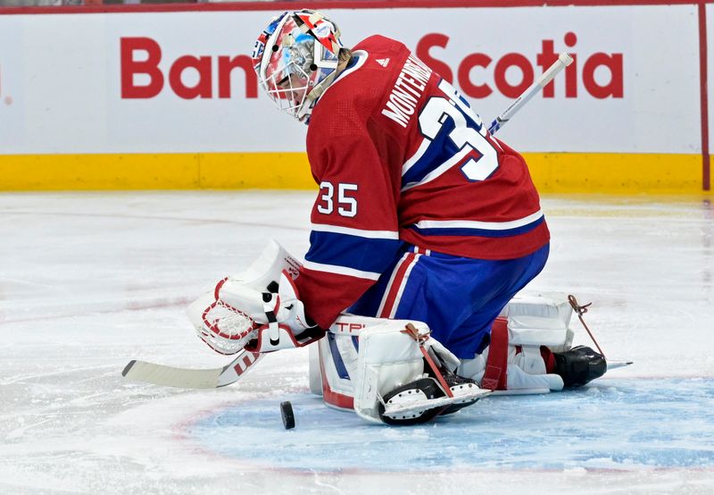 Jan 25, 2024; Montreal, Quebec, CAN; Montreal Canadiens goalie Sam Montembeault (35) makes a pad save during the second period of the game against the New York Islanders at the Bell Centre. Mandatory Credit: Eric Bolte-USA TODAY Sports