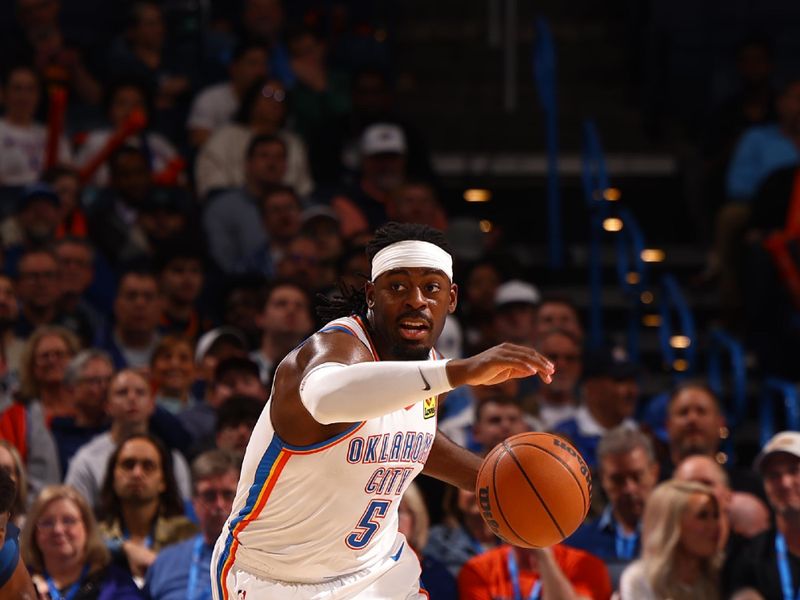 OKLAHOMA CITY, OK - FEBRUARY 24:  Luguentz Dort #5 of the Oklahoma City Thunder handles the ball during the game against the Minnesota Timberwolves on February 24, 2025 at Paycom Center in Oklahoma City, Oklahoma. NOTE TO USER: User expressly acknowledges and agrees that, by downloading and or using this photograph, User is consenting to the terms and conditions of the Getty Images License Agreement. Mandatory Copyright Notice: Copyright 2025 NBAE (Photo by Zach Beeker/NBAE via Getty Images)
