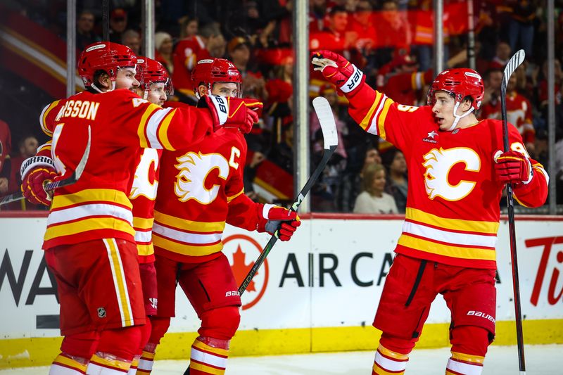 Jan 28, 2025; Calgary, Alberta, CAN; Calgary Flames center Blake Coleman (20) celebrates his goal with teammates against the Washington Capitals during the second period at Scotiabank Saddledome. Mandatory Credit: Sergei Belski-Imagn Images