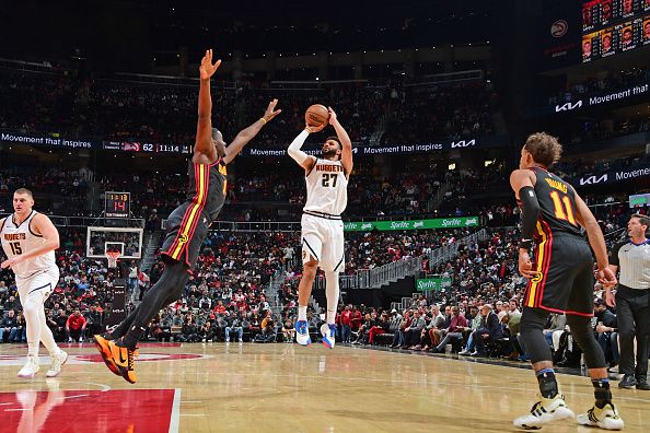 ATLANTA, GA - DECEMBER 11: Jamal Murray #27 of the Denver Nuggets shoots the ball during the game against the Atlanta Hawks on December 11, 2023 at State Farm Arena in Atlanta, Georgia.  NOTE TO USER: User expressly acknowledges and agrees that, by downloading and/or using this Photograph, user is consenting to the terms and conditions of the Getty Images License Agreement. Mandatory Copyright Notice: Copyright 2023 NBAE (Photo by Scott Cunningham/NBAE via Getty Images)