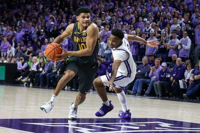 Jan 16, 2024; Manhattan, Kansas, USA; Baylor Bears guard RayJ Dennis (10) drives to the basket against Kansas State Wildcats guard Tylor Perry (2) during the second half at Bramlage Coliseum. Mandatory Credit: Scott Sewell-USA TODAY Sports