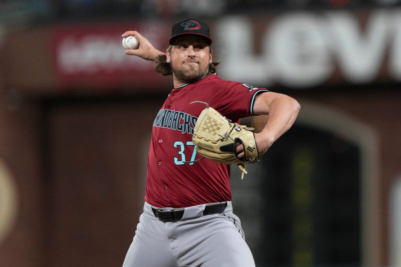 Sep 4, 2024; San Francisco, California, USA;  Arizona Diamondbacks pitcher Kevin Ginkel (37) pitches during the seventh inning against the San Francisco Giants at Oracle Park. Mandatory Credit: Stan Szeto-Imagn Images