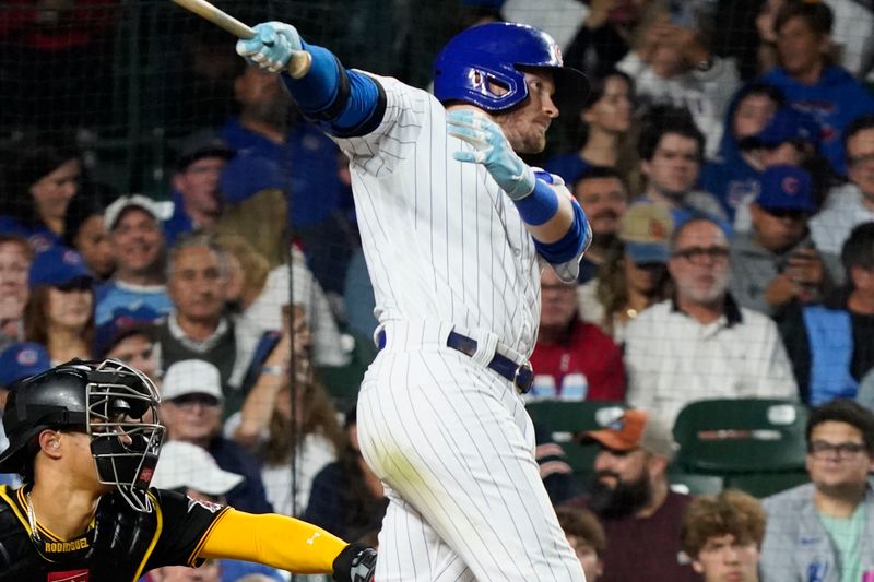 Sep 21, 2023; Chicago, Illinois, USA; Chicago Cubs left fielder Ian Happ (8) hits a single against the Pittsburgh Pirates during the seventh inning at Wrigley Field. Mandatory Credit: David Banks-USA TODAY Sports