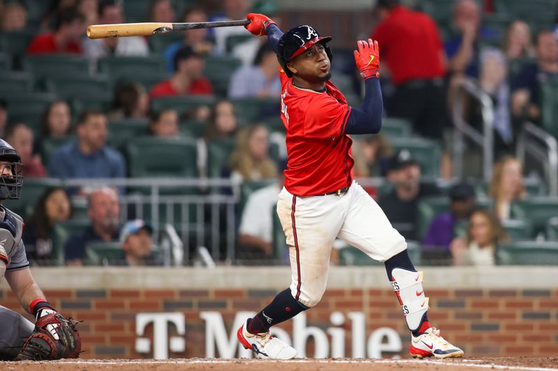 Apr 26, 2024; Atlanta, Georgia, USA; Atlanta Braves second baseman Ozzie Albies (1) hits a double against the Cleveland Guardians in the fifth inning at Truist Park. Mandatory Credit: Brett Davis-USA TODAY Sports
