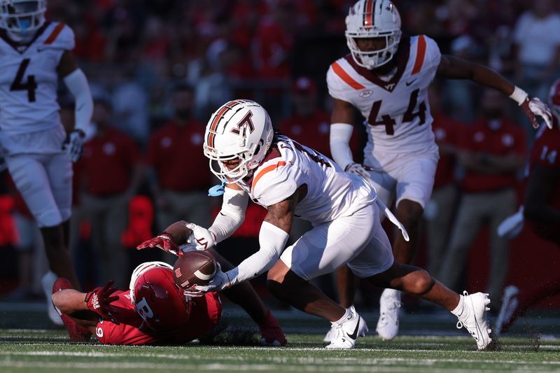 Sep 16, 2023; Piscataway, New Jersey, USA;  Virginia Tech Hokies cornerback Derrick Canteen (13) can not secure an interception on a pass intended for Rutgers Scarlet Knights wide receiver Ian Strong (29) during the second half at SHI Stadium. Mandatory Credit: Vincent Carchietta-USA TODAY Sports