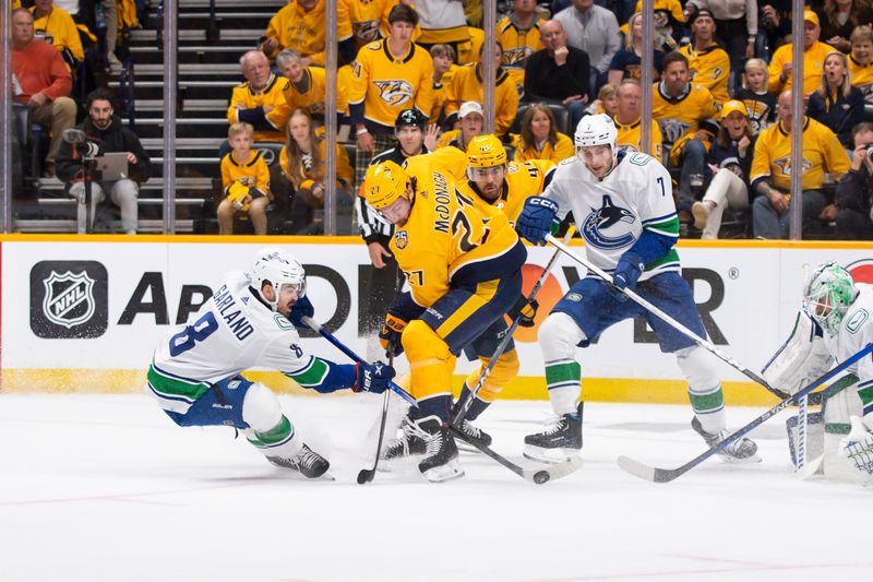 Apr 26, 2024; Nashville, Tennessee, USA; Vancouver Canucks right wing Conor Garland (8) and Nashville Predators defenseman Ryan McDonagh (27) fight for the puck during the first period in game three of the first round of the 2024 Stanley Cup Playoffs at Bridgestone Arena. Mandatory Credit: Steve Roberts-USA TODAY Sports