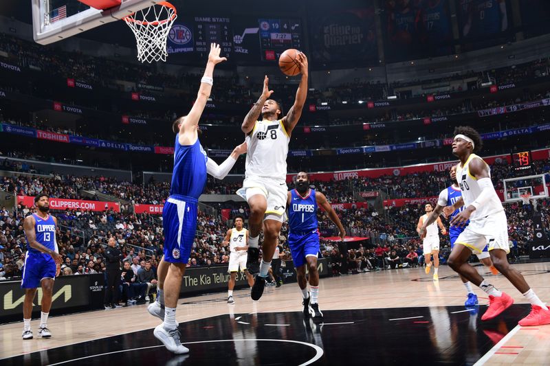 LOS ANGELES, CA - APRIL 5:  Brice Sensabaugh #8 of the Utah Jazz goes to the basket during the game on April 5, 2024 at Crypto.Com Arena in Los Angeles, California. NOTE TO USER: User expressly acknowledges and agrees that, by downloading and/or using this Photograph, user is consenting to the terms and conditions of the Getty Images License Agreement. Mandatory Copyright Notice: Copyright 2024 NBAE (Photo by Adam Pantozzi/NBAE via Getty Images)