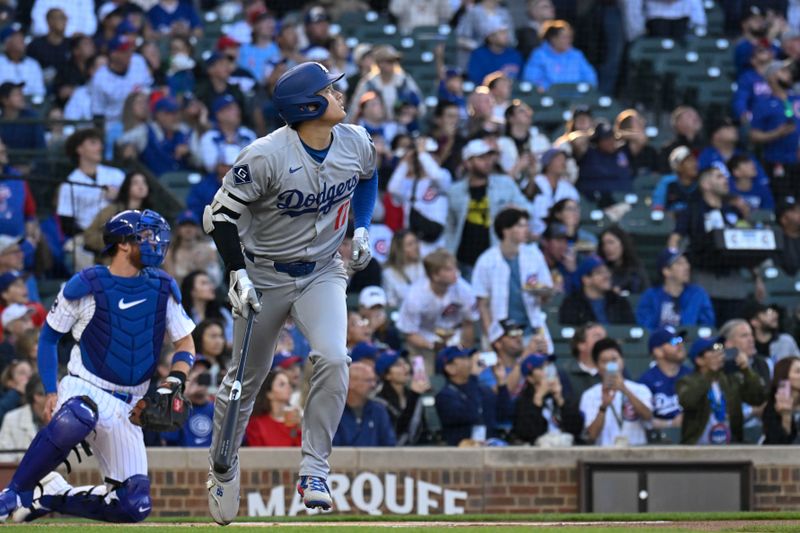 Apr 23, 2025; Chicago, Illinois, USA;  Los Angeles Dodgers two-way player Shohei Ohtani (17) watches his fly ball during the first inning against the Chicago Cubs at Wrigley Field. Mandatory Credit: Matt Marton-Imagn Images