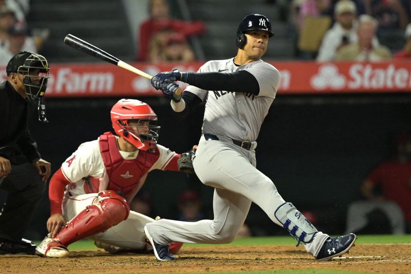 May 30, 2024; Anaheim, California, USA;  New York Yankees right fielder Juan Soto (22) triples in three runs in the seventh inning against the Los Angeles Angels at Angel Stadium. Mandatory Credit: Jayne Kamin-Oncea-USA TODAY Sports