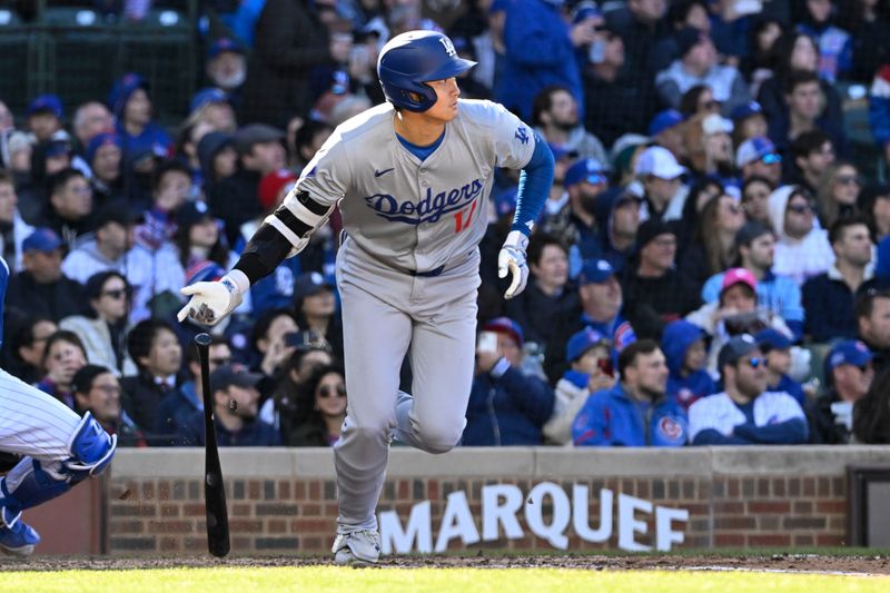 Apr 6, 2024; Chicago, Illinois, USA;  Los Angeles Dodgers two-way player Shohei Ohtani (17) singles during the fifth inning against the Chicago Cubs at Wrigley Field. Mandatory Credit: Matt Marton-USA TODAY Sports