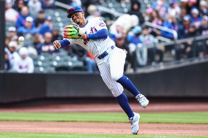Apr 13, 2024; New York City, New York, USA;  New York Mets shortstop Francisco Lindor (12) makes an off balanced throw to first base for an assist in the first inning against the Kansas City Royals at Citi Field. Mandatory Credit: Wendell Cruz-USA TODAY Sports