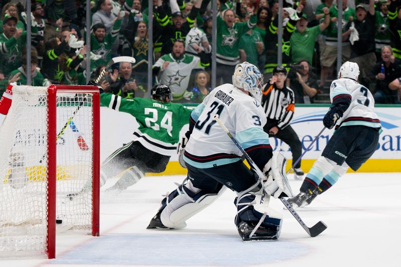 May 15, 2023; Dallas, Texas, USA; Dallas Stars center Roope Hintz (24) celebrates after he scores a goal on a breakaway shot against Seattle Kraken goaltender Philipp Grubauer (31) during the second period in game seven of the second round of the 2023 Stanley Cup Playoffs at the American Airlines Center. Mandatory Credit: Jerome Miron-USA TODAY Sports