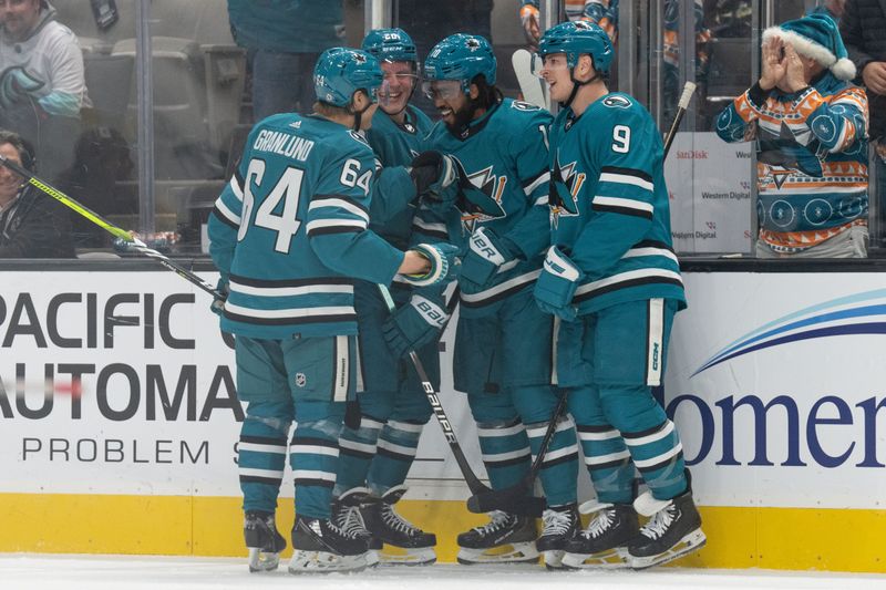 Dec 21, 2023; San Jose, California, USA; San Jose Sharks left wing Anthony Duclair (10) celebrates with teammates after scoring a goal during the second period against the Arizona Coyotes at SAP Center at San Jose. Mandatory Credit: Stan Szeto-USA TODAY Sports