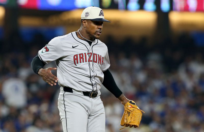 Jul 4, 2024; Los Angeles, California, USA; Arizona Diamondbacks pitcher Thyago Vieira (49) reacts after a strikeout during the ninth inning against the Los Angeles Dodgers at Dodger Stadium. Mandatory Credit: Jason Parkhurst-USA TODAY Sports