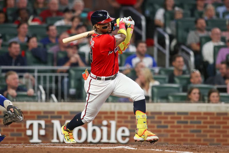 Sep 28, 2023; Atlanta, Georgia, USA; Atlanta Braves right fielder Ronald Acuna Jr. (13) hits a RBI single against the Chicago Cubs in the second inning at Truist Park. Mandatory Credit: Brett Davis-USA TODAY Sports
