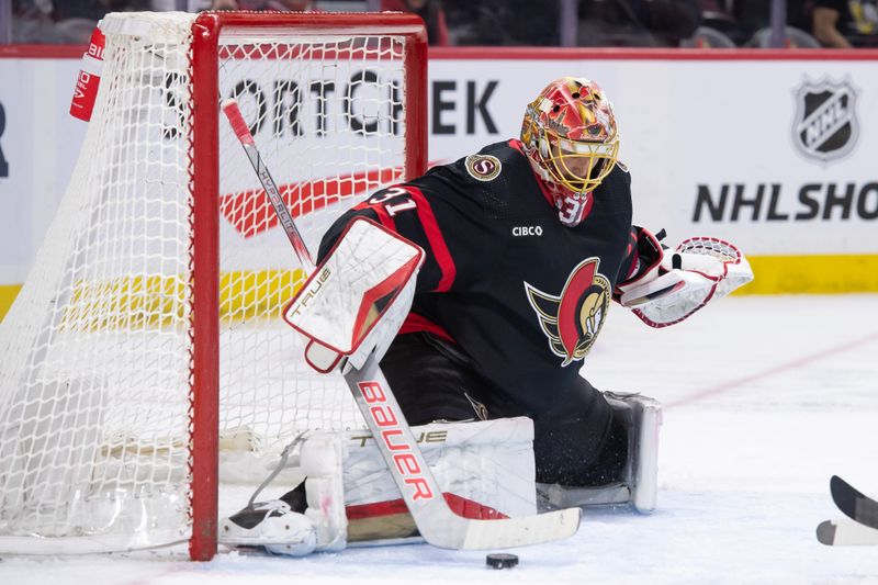 Feb 13, 2024; Ottawa, Ontario, CAN; Ottawa Senators goalie Anton Forsberg (31) makes a save in the second period against the Columbus Blue Jackets at the Canadian Tire Centre. Mandatory Credit: Marc DesRosiers-USA TODAY Sports